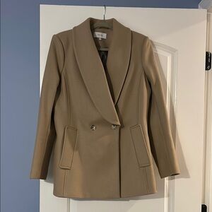 Cream Pea Coat with Wide Lapels and Double-Breasted Closure